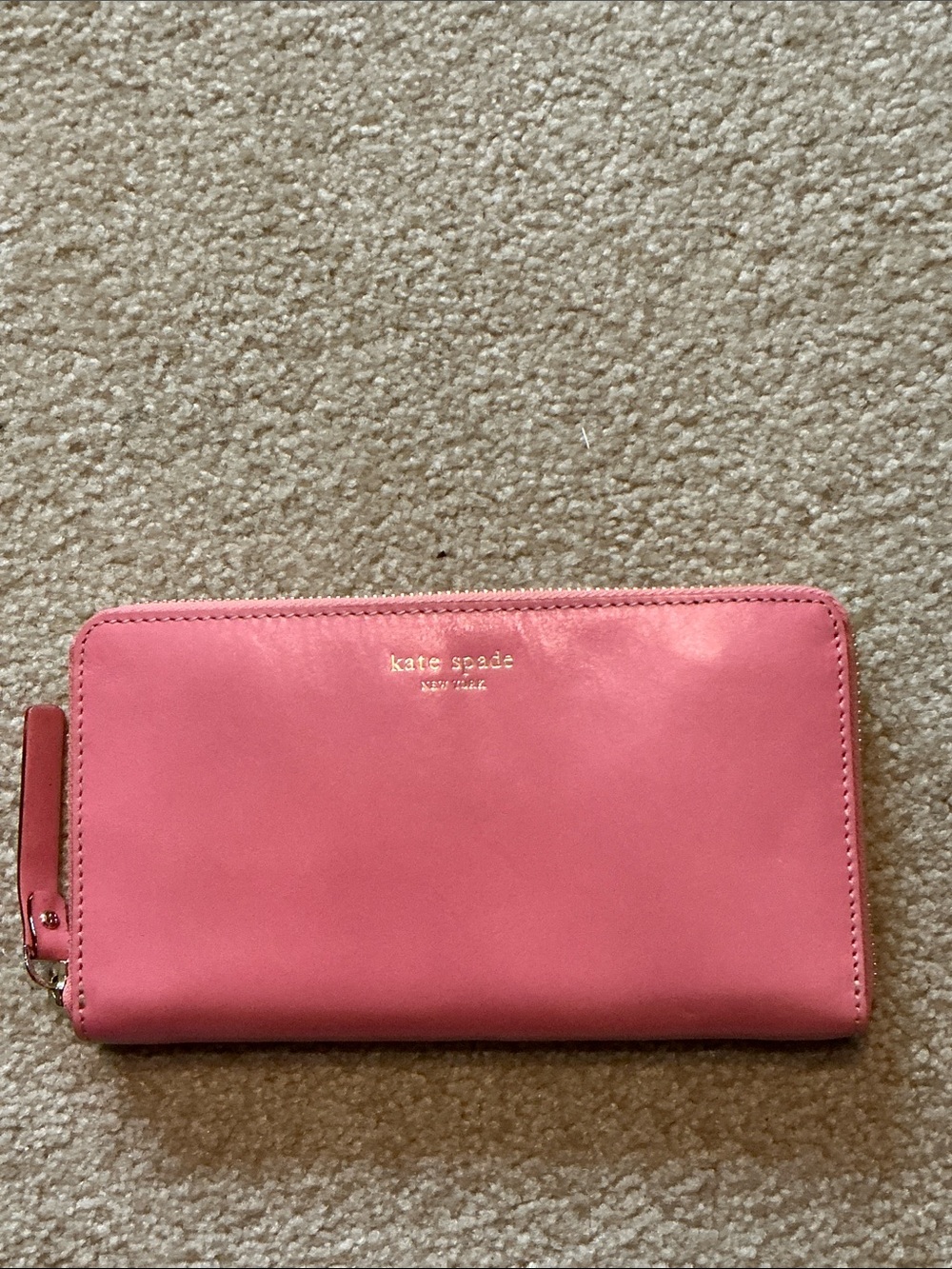 kate spade pink zip-around leather wallet with gold logo